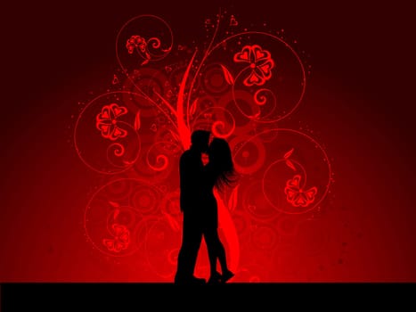 Silhouette of a kissing couple on a decorative background