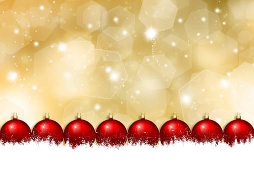 Christmas baubles in snow on a glittery gold Christmas background
