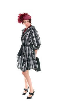 The woman with a bag in a ladies&#039  hat isolated on white background