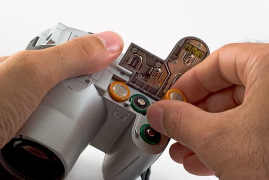 The photographer cleans an objective of a digital camera