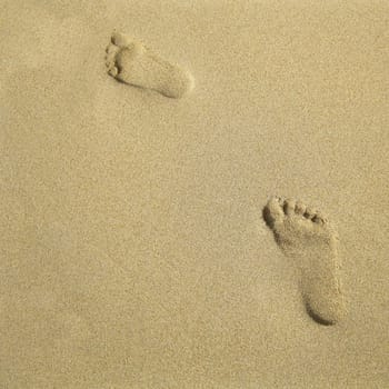 Two footprints in the sand