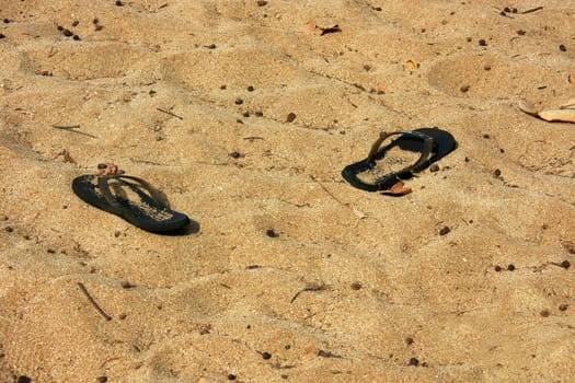 A forgotten pair of shoes on the autumn beach