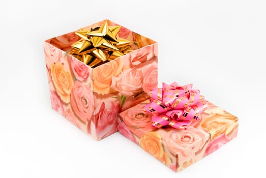 Gift box of yellow color with a pink tape
