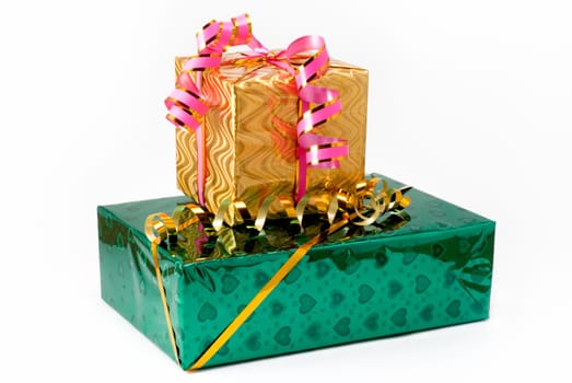 Two gift boxes of green and yellow color with yellow and pink tapes