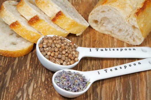 Old table-top selection of herbs and grains in measuring spoons