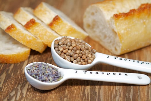 Old table-top selection of herbs and grains in measuring spoons