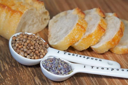 Old table-top selection of herbs and grains in measuring spoons
