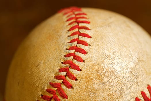 Close up macro view of the seams on a used baseball