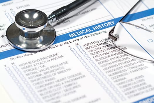 Close up of a Medical History form and a doctor&#039 s Stethoscope