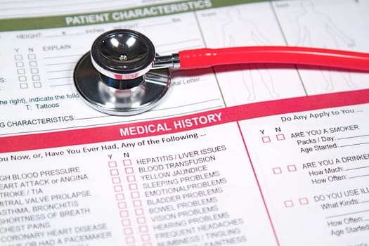 Close up of a Medical History form and a doctor&#039 s Stethoscope