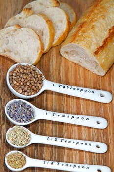 Old table-top selection of herbs and grains in measuring spoons
