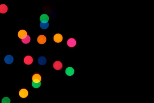 A background of colorful blurred stage lights