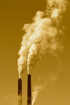 A tall smokestack spewing out dirty polluted smoke