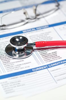 Close up of a Medical History form and a doctor&#039 s Stethoscope