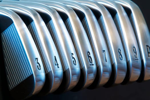 A brand new set of golf club irons