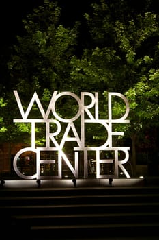 An outdoor sign in front of the Denver Colorado WOrld Trade Center