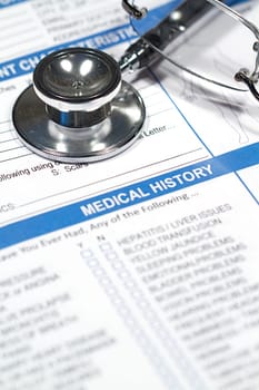 Close up of a Medical History form and a doctor&#039 s Stethoscope
