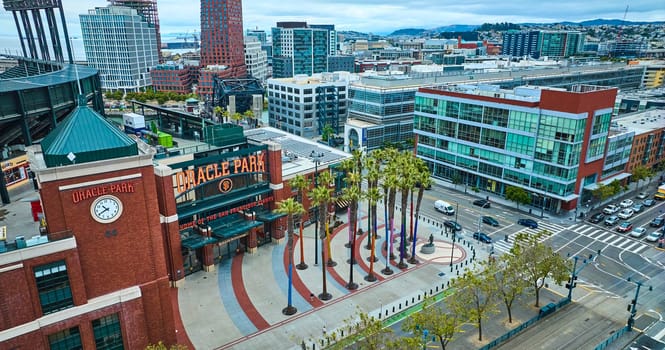 Image of Willie Mays Gate wide aerial of Oracle Park front entrance with statue and palm trees