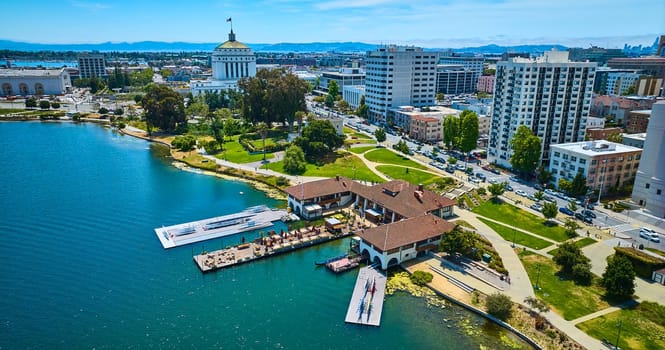 Image of The Lake Chalet Seafood Bar & Grill on Lake Merritt aerial of Oakland city and skyscrapers