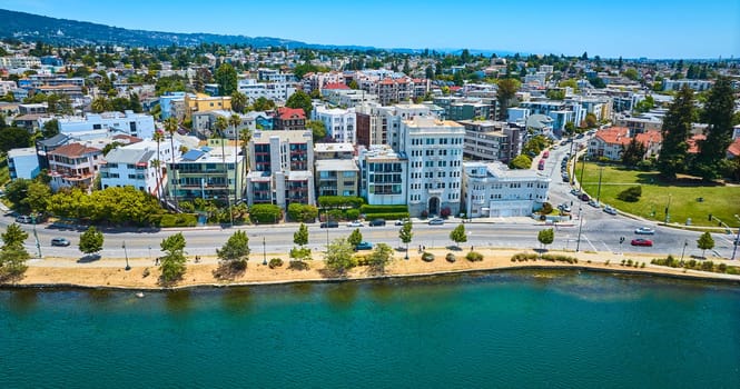 Image of Gorgeous summer aerial of Oakland residential area with Lake Merritt shoreline