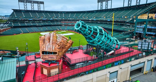 Image of Aerial close up of Coca Cola slide at Oracle Park with people on field