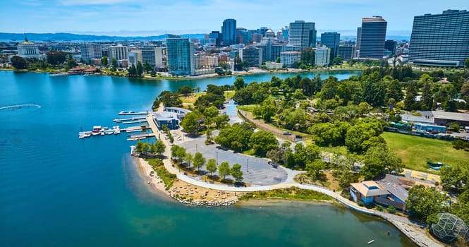 Image of Aerial over Lake Merritt with boating center and downtown skyscrapers