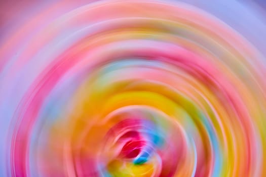 Image of Abstract rainbow flower in circle artistic blur