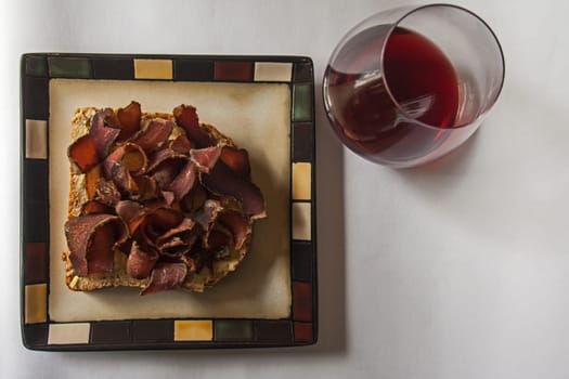 Biltong is a South African delicacy of cured and dried meat perfectly accompanied by a good red wine