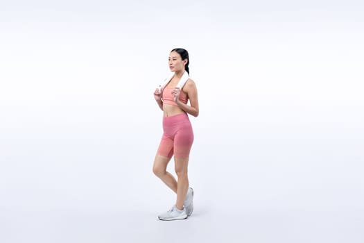 Full body asian woman in sportswear portrait, smiling and posing cheerful gesture. Workout training with attractive girl engage in her pursuit of healthy lifestyle. Isolated background Vigorous