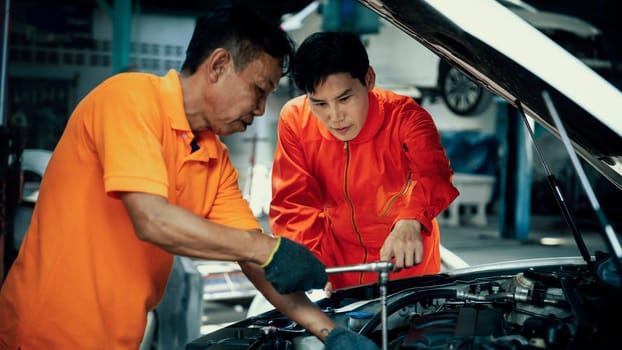 Panoramic banner automotive service mechanic inspect and diagnose car engine issue, repairing and fixing problem in workshop. Technician car care maintenance working on internal components. Oxus