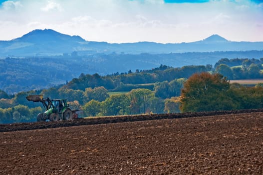 Tractor with plough