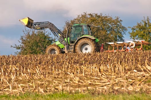 Tractor with plough