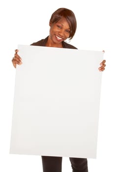 An african american woman is holding a blank white sign.