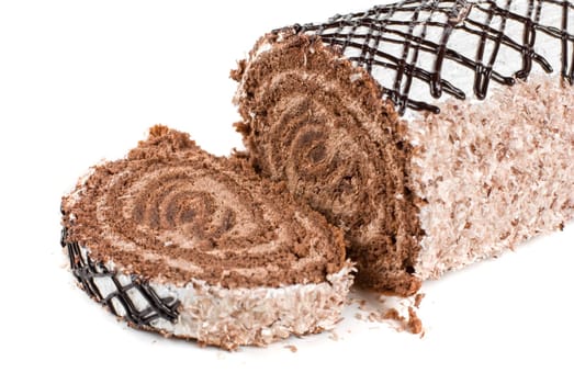 Chocolate Swiss roll closeup isolated on a white background