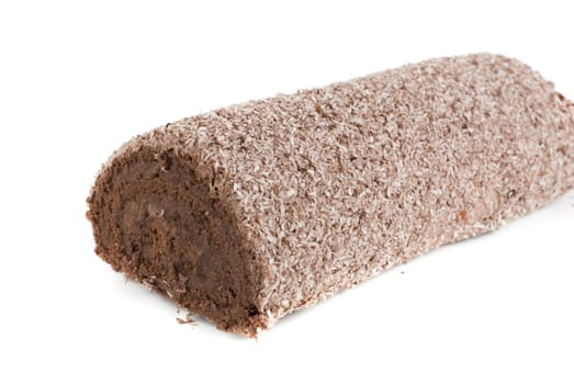 Chocolate Swiss roll closeup isolated on a white background