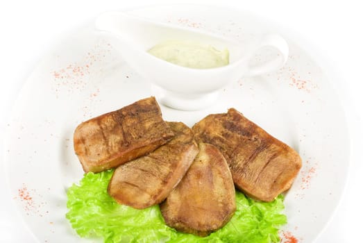 Beef tongue closeup with sauce isolated on a white background