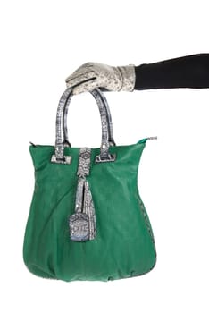 green women bag at hand isolated on white background