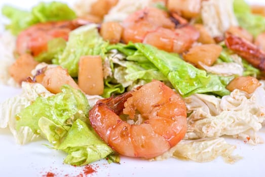 Salad with tiger shrimps and vegetable closeup