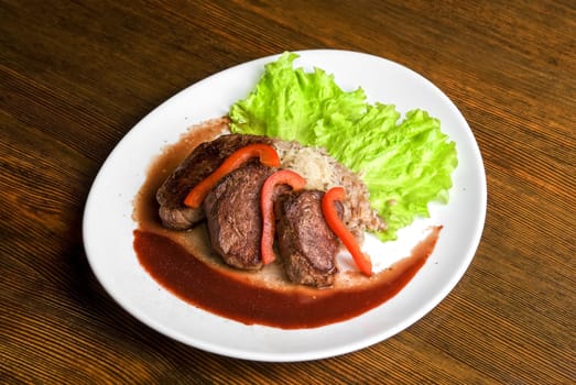 Roast maral meat with blood and garnish pearl barley - very tasty dish