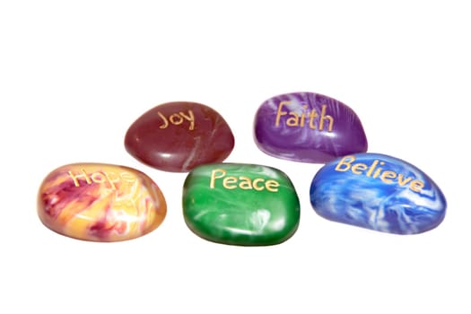 five stones inscribed hope joy peace faith and believe