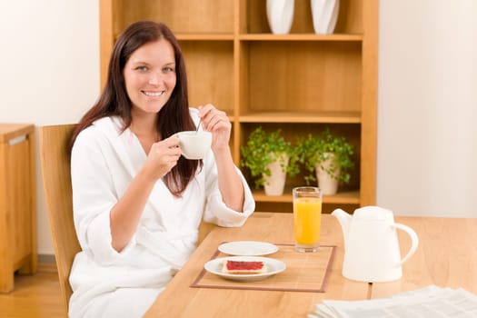 Breakfast coffee and toast happy woman in home bathrobe
