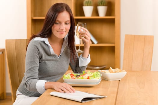 Healthy lunch at home attractive woman read magazine drink wine