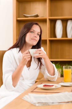 Breakfast coffee and toast dreamy woman in home bathrobe