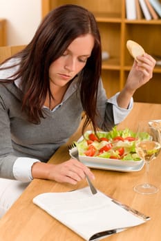 Healthy lunch at home attractive woman read magazine eat salad
