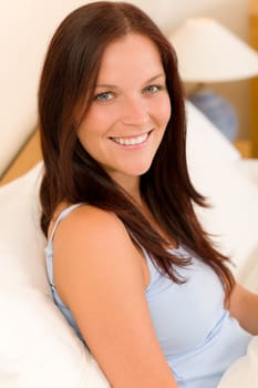 Bedroom - beautiful woman morning waking up sitting on white bed