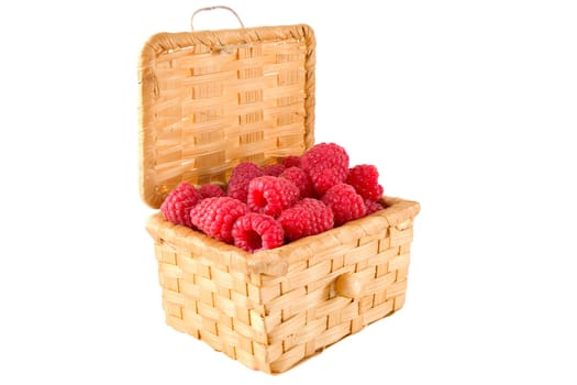 The bast-basket with a raspberry is photographed on a white background