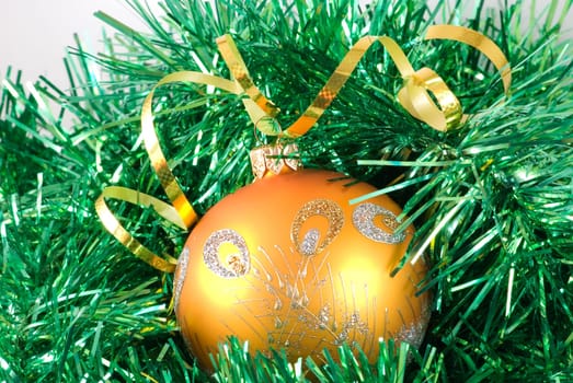 The Christmas-tree toy on the green background