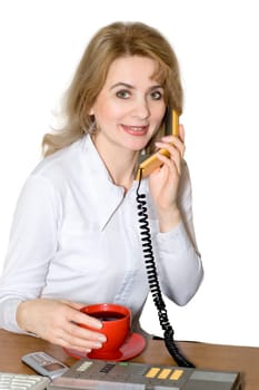 Businesswoman speak by phone and holds a cup of coffee in a hand