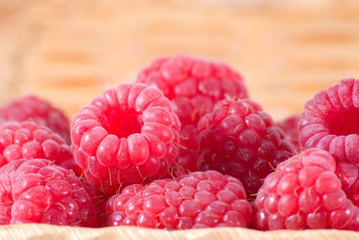 The bast-basket with a raspberry is photographed a close-up