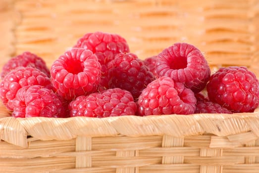 The bast-basket with a raspberry is photographed a close-up